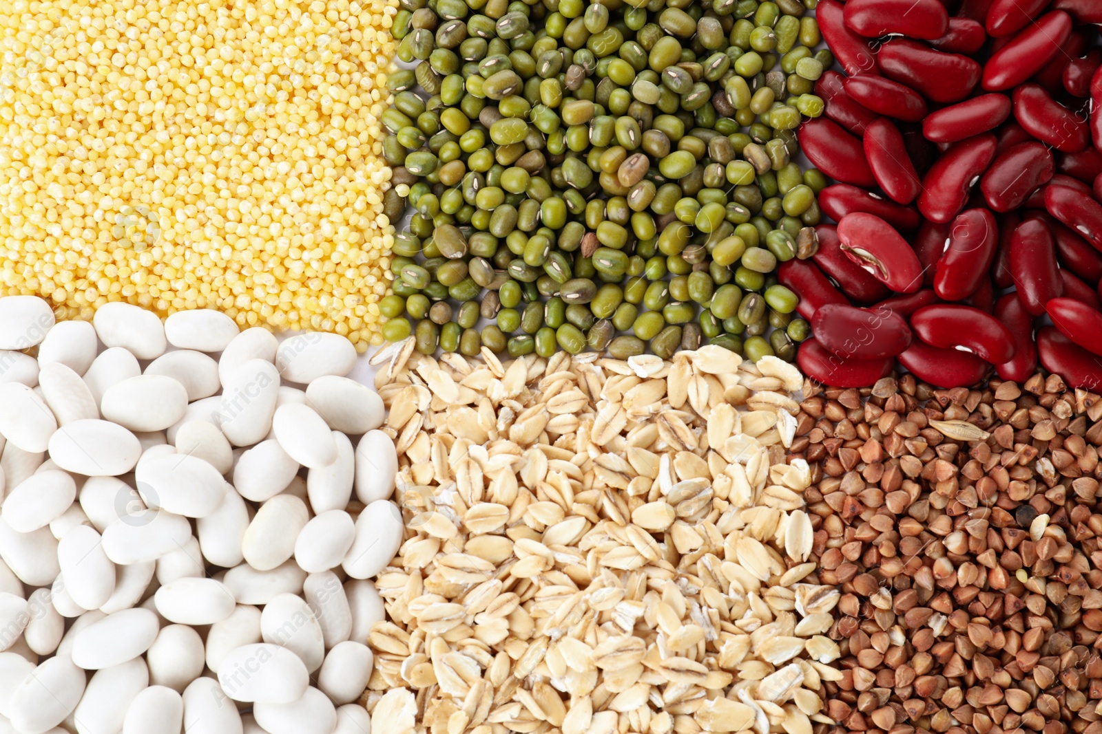 Photo of Different grains and cereals as background, top view