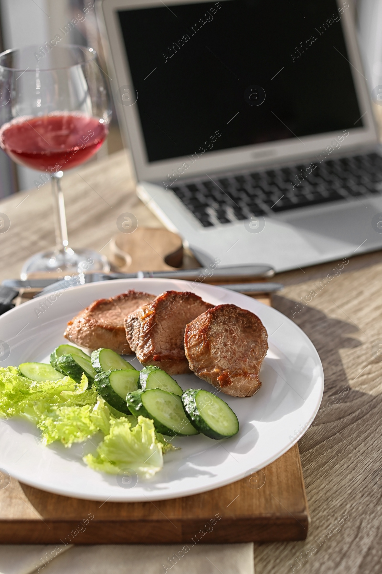 Photo of Plate with delicious meal on wooden table. Food blogger