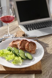 Plate with delicious meal on wooden table. Food blogger