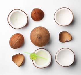 Photo of Composition with coconuts and drink on white background, top view