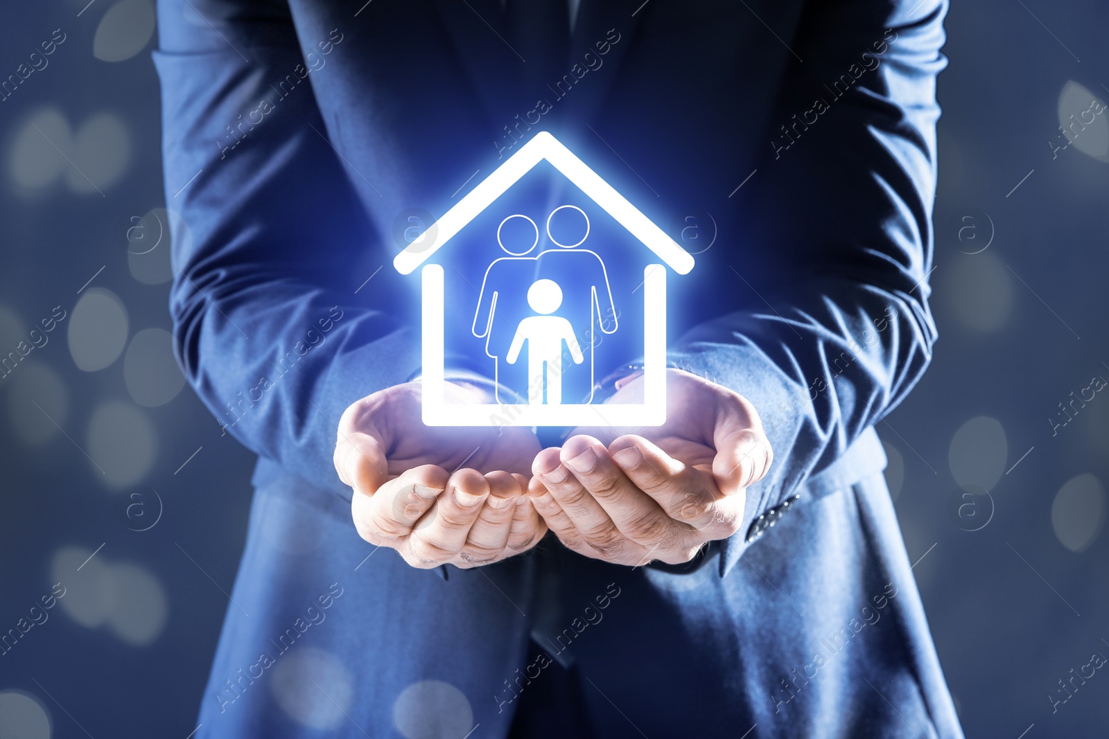 Image of Property insurance concept. Man demonstrating house with family image, closeup