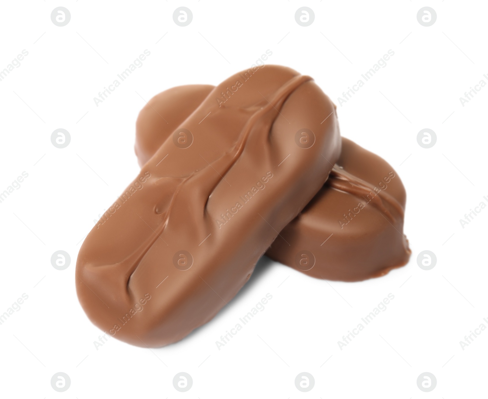 Photo of Delicious milk chocolate candy bars on white background