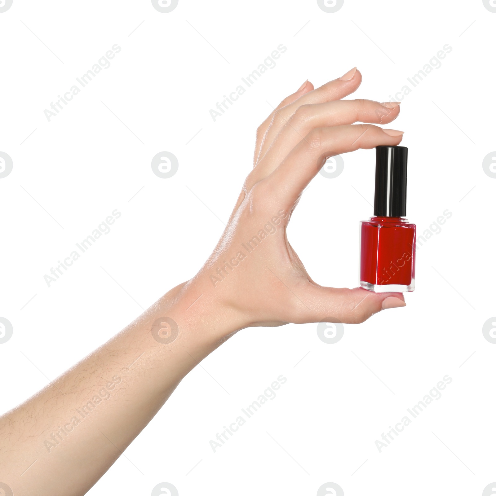 Photo of Woman holding nail polish on white background, closeup