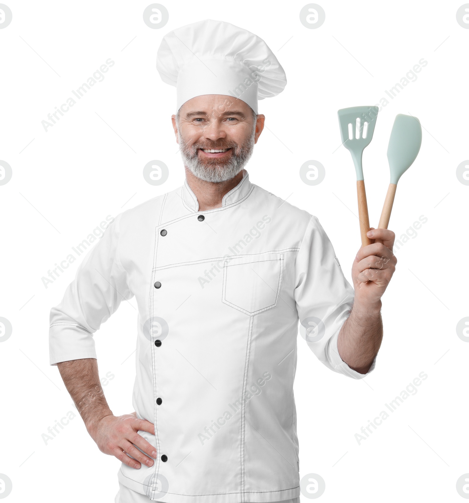 Photo of Happy chef in uniform holding kitchen utensils on white background