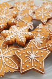 Photo of Tasty Christmas cookies on plate, closeup view