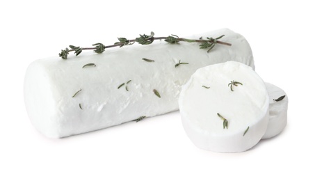 Photo of Delicious goat cheese with thyme on white background
