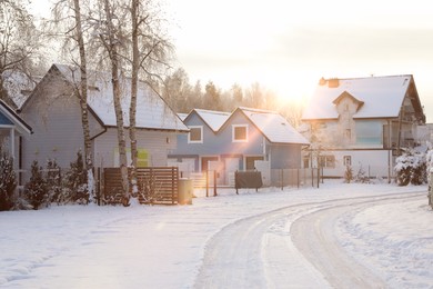 Photo of Winter landscape with beautiful houses, trees and bushes in morning