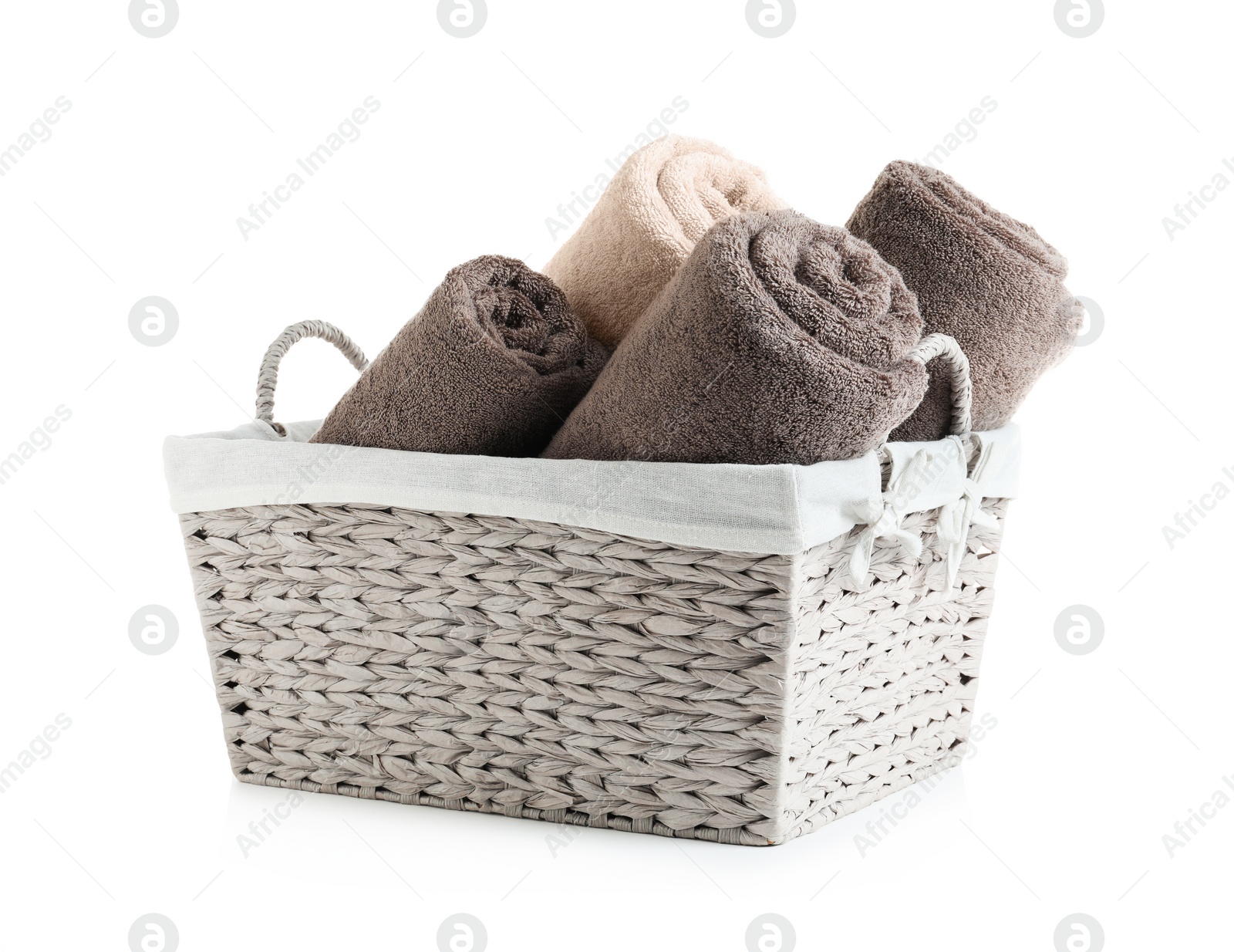 Photo of Basket with rolled towels isolated on white