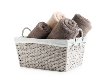Basket with rolled towels isolated on white