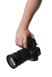 Photographer holding modern camera on white background, closeup