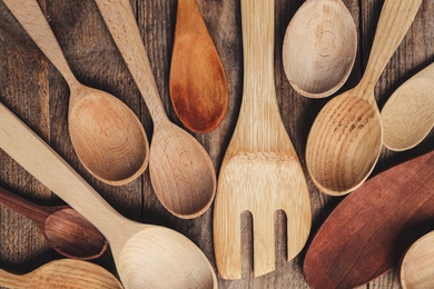 Cooking utensils on wooden table, flat lay