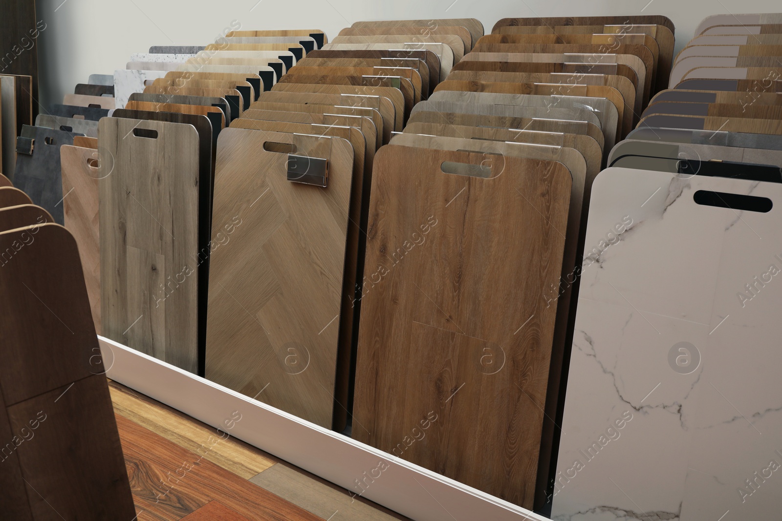 Photo of Many different samples of wooden flooring in store