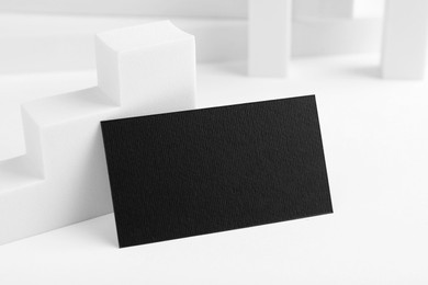 Photo of Blank black business card on white background. Mockup for design