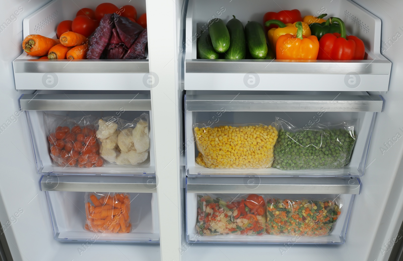 Photo of Open refrigerator full of different fresh products