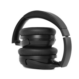 Photo of Modern black wireless headphones isolated on white