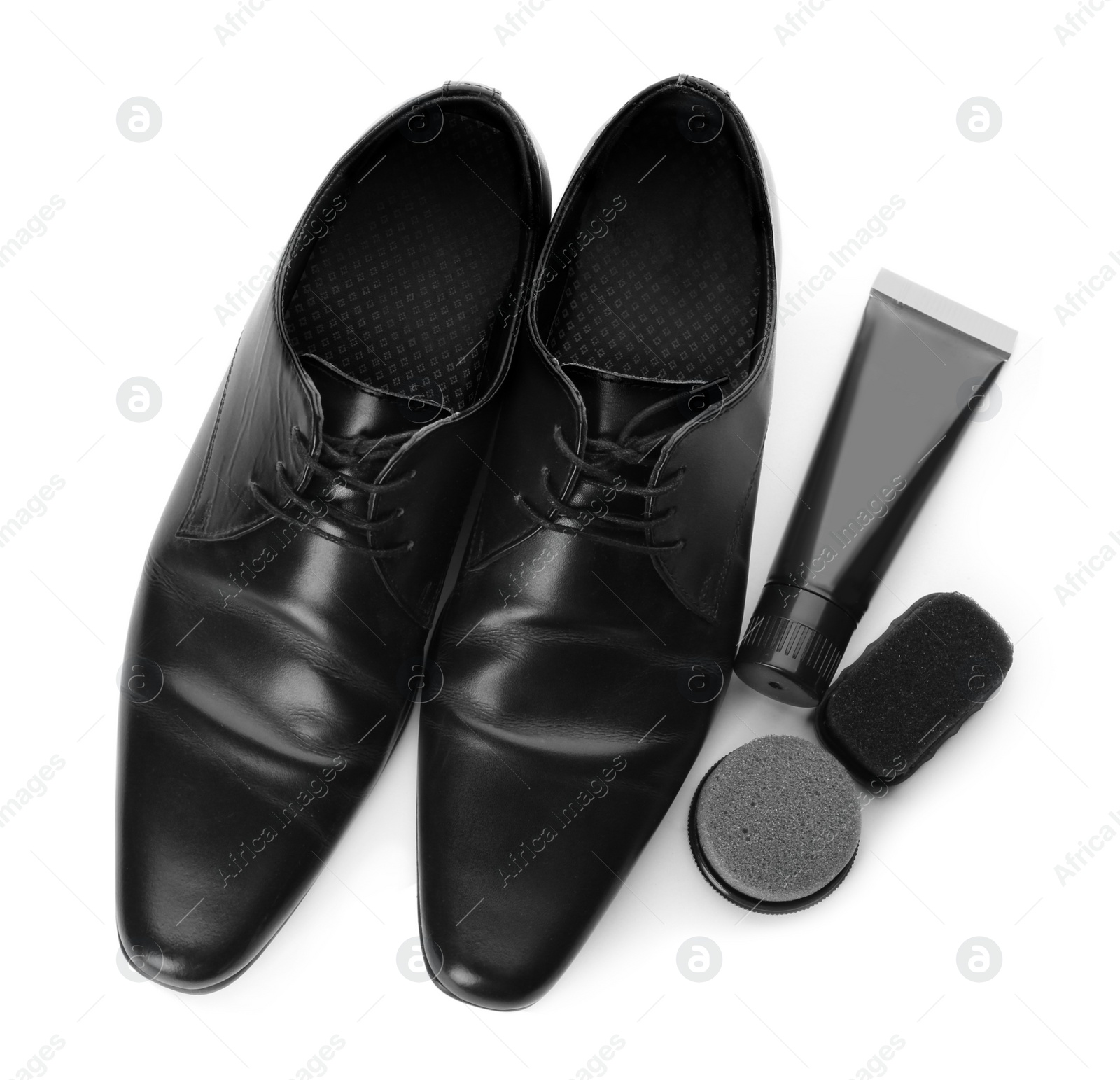 Photo of Stylish footwear and shoe care products on white background, top view