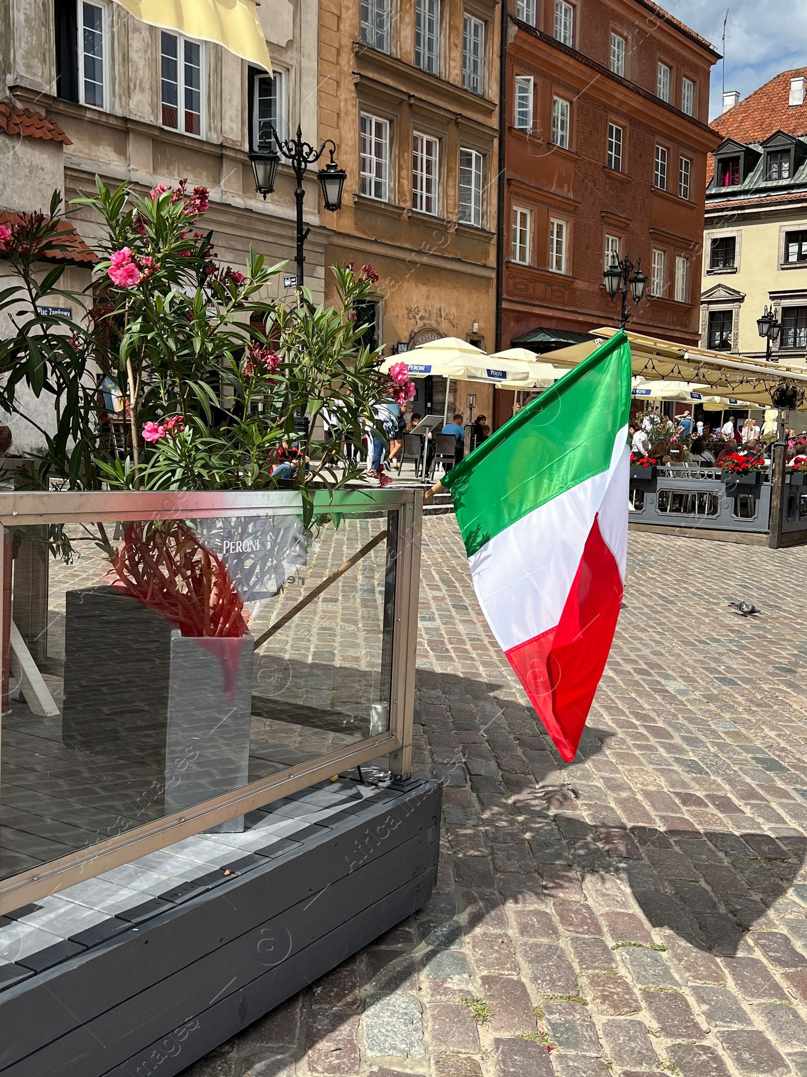 Photo of WARSAW, POLAND - JULY 17, 2022: Italy flag fluttering outdoors on sunny day