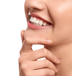 Young woman with beautiful smile on white background, closeup. Teeth whitening