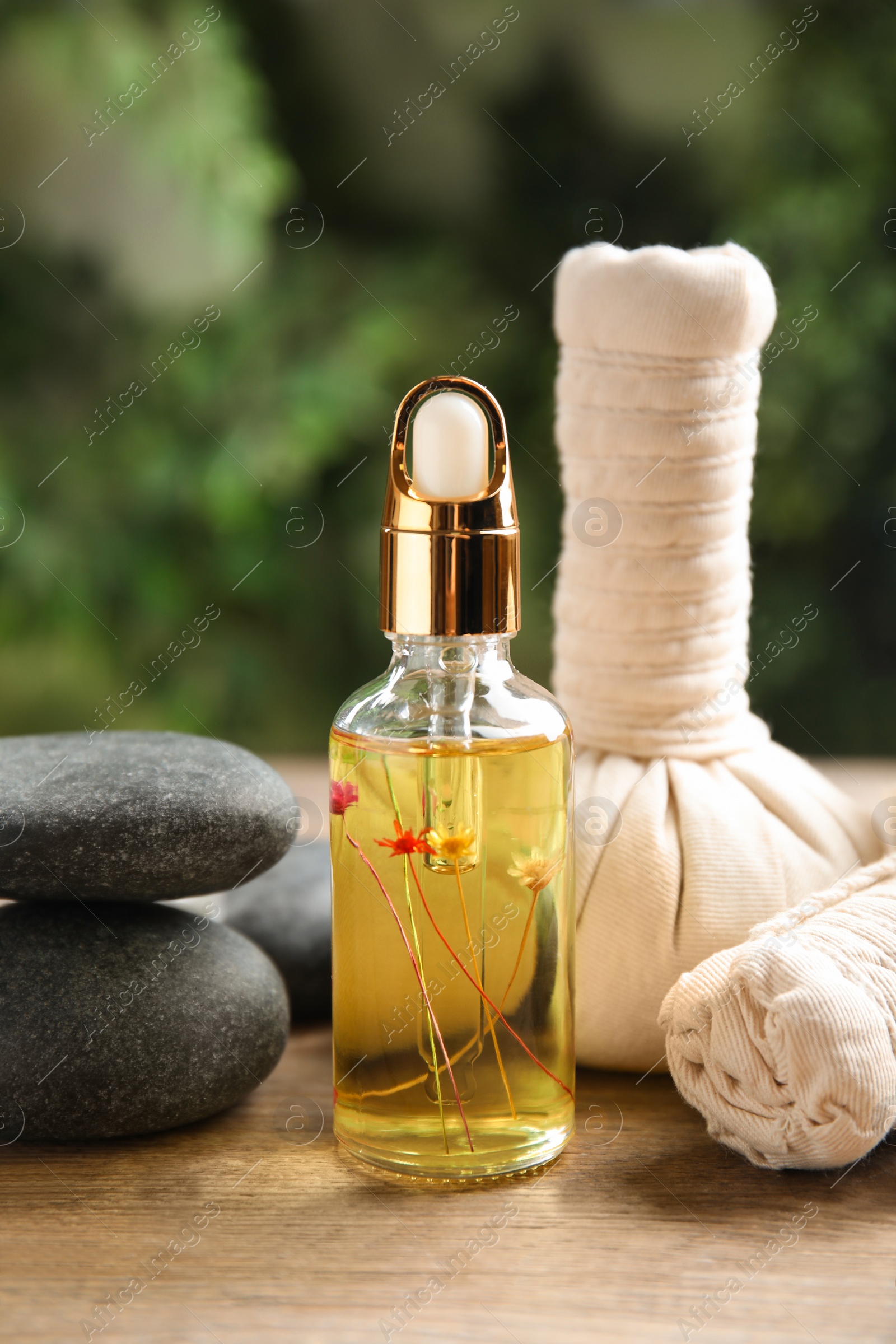 Photo of Composition with spa cosmetic on wooden table, closeup
