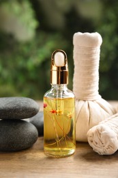 Photo of Composition with spa cosmetic on wooden table, closeup