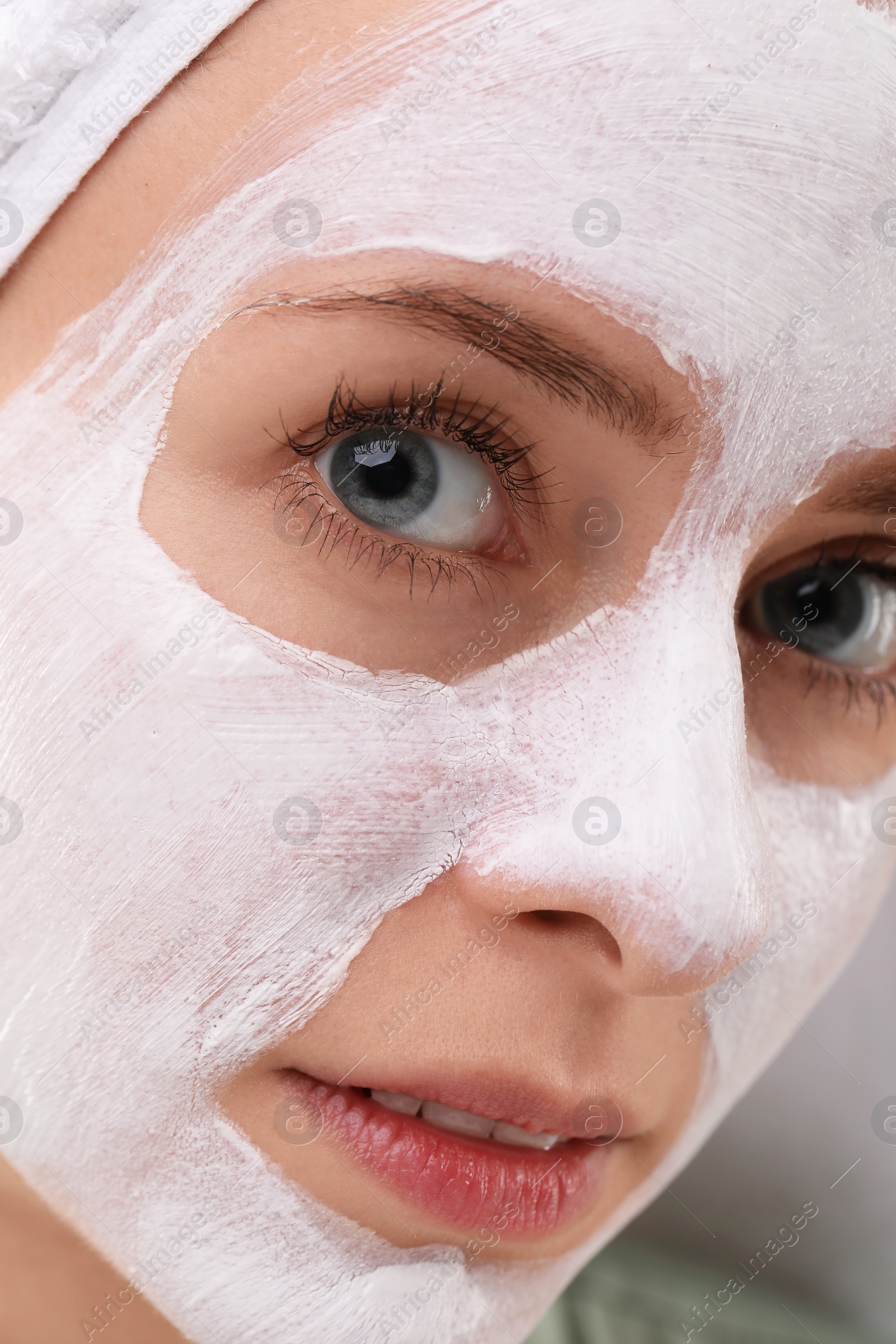 Photo of Woman with face mask, closeup. Spa treatments