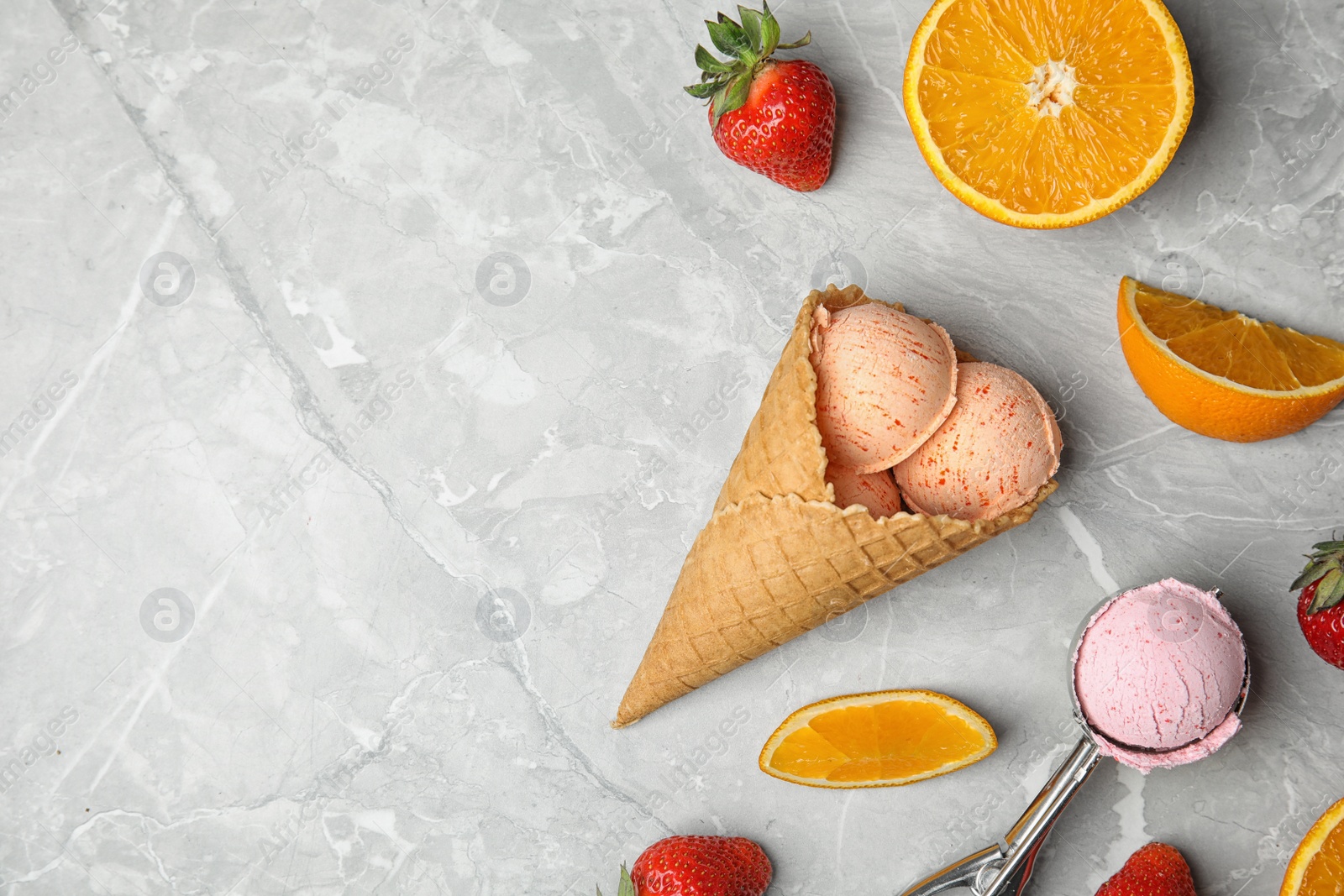 Photo of Flat lay composition with delicious ice creams on table, space for text