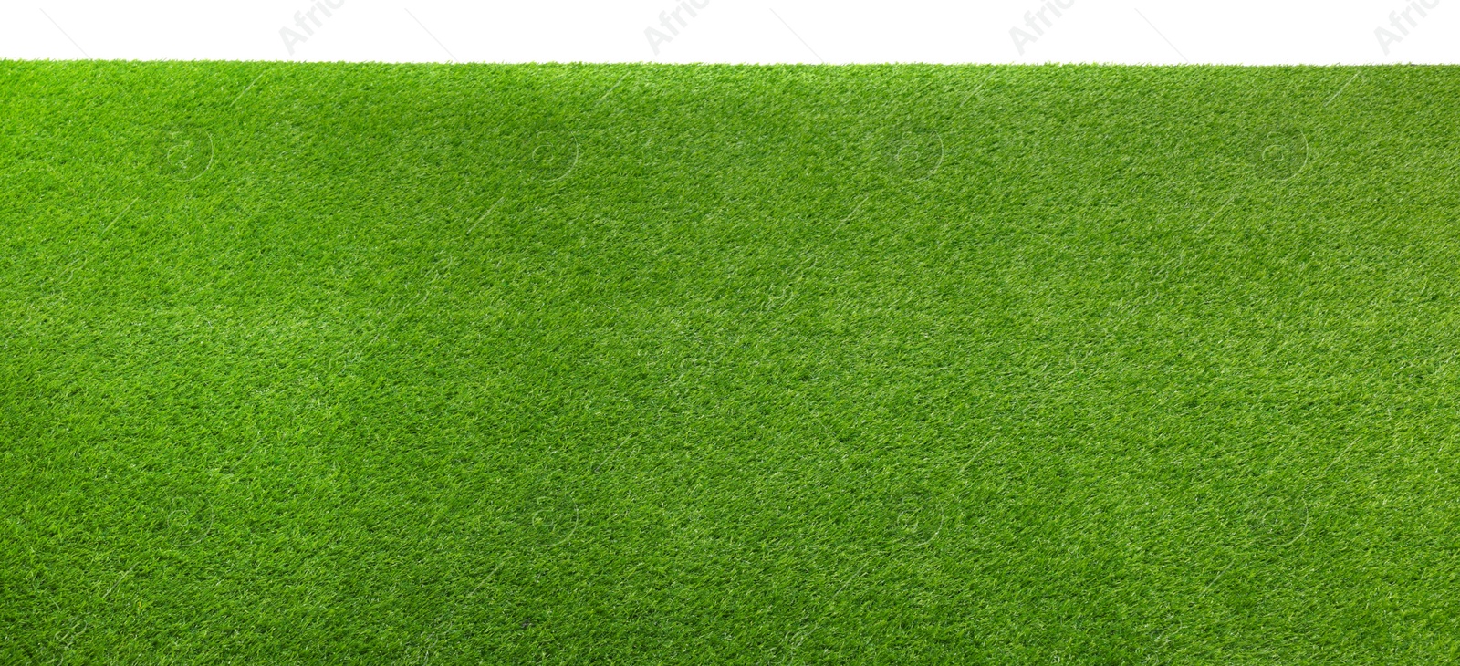 Photo of Green artificial grass surface isolated on white