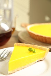 Photo of Slice of delicious homemade lemon pie on plate