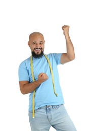 Photo of Overweight man with measuring tape on white background