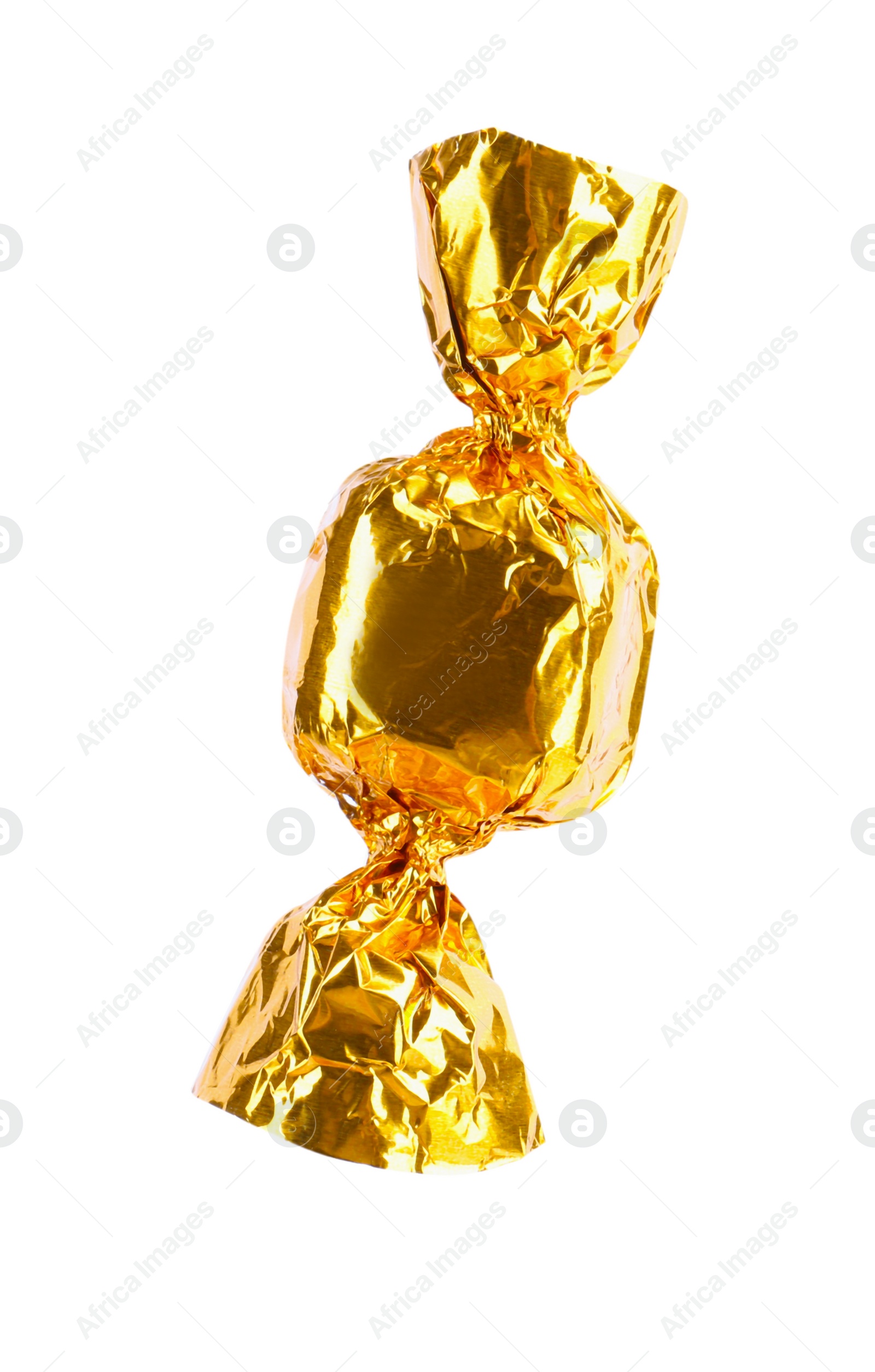 Photo of Tasty candy in golden wrapper isolated on white
