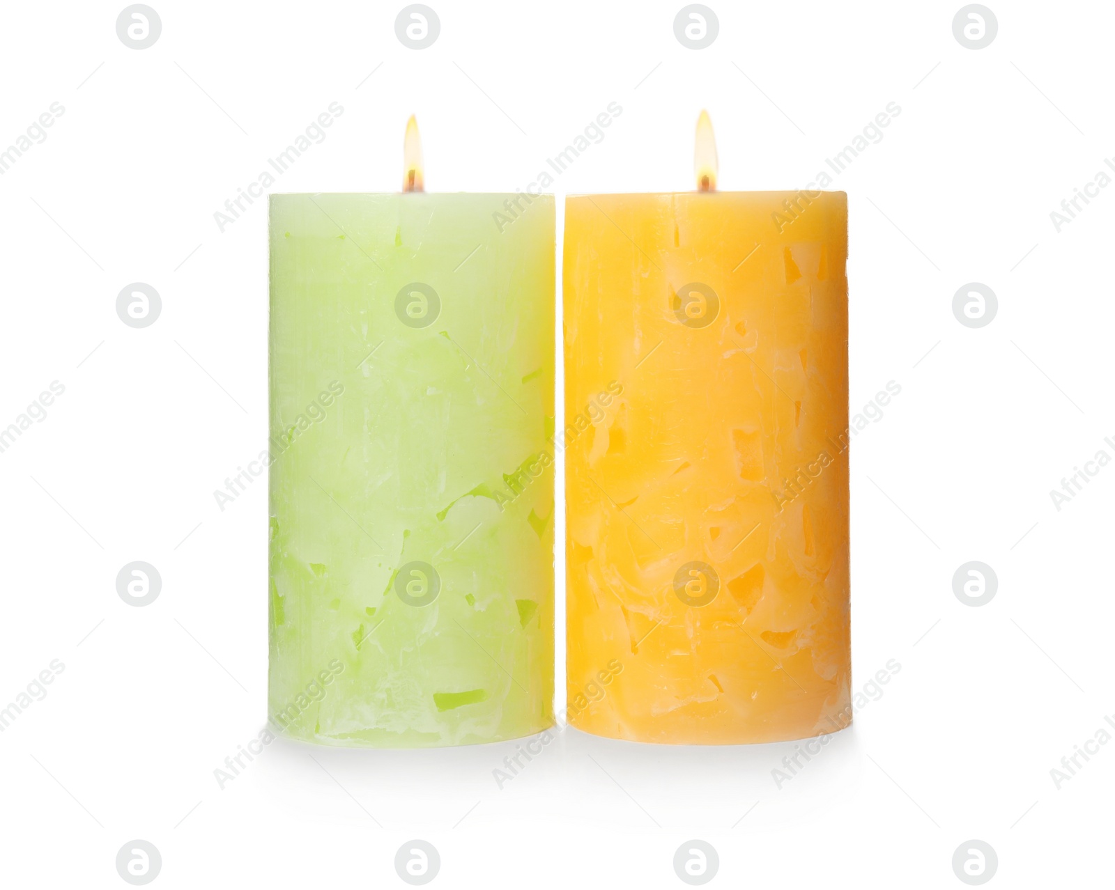 Photo of Alight color wax candles on white background