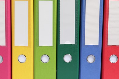 Photo of Bright binder office folders as background, closeup