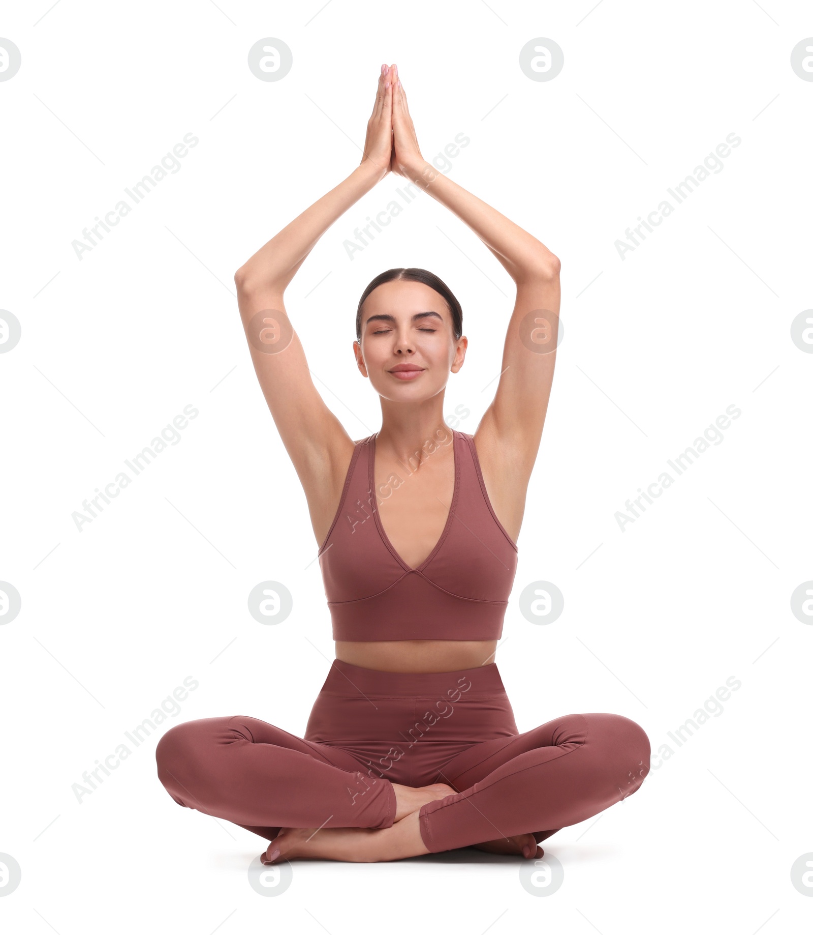 Photo of Beautiful young woman practicing yoga on white background. Lotus pose