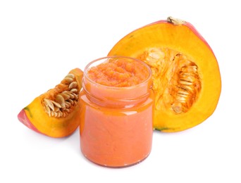 Photo of Jar of pumpkin jam and fresh pumpkin on white background