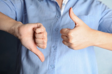 Woman showing hand sign, closeup. Body language