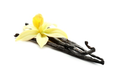 Photo of Aromatic vanilla sticks and flower on white background