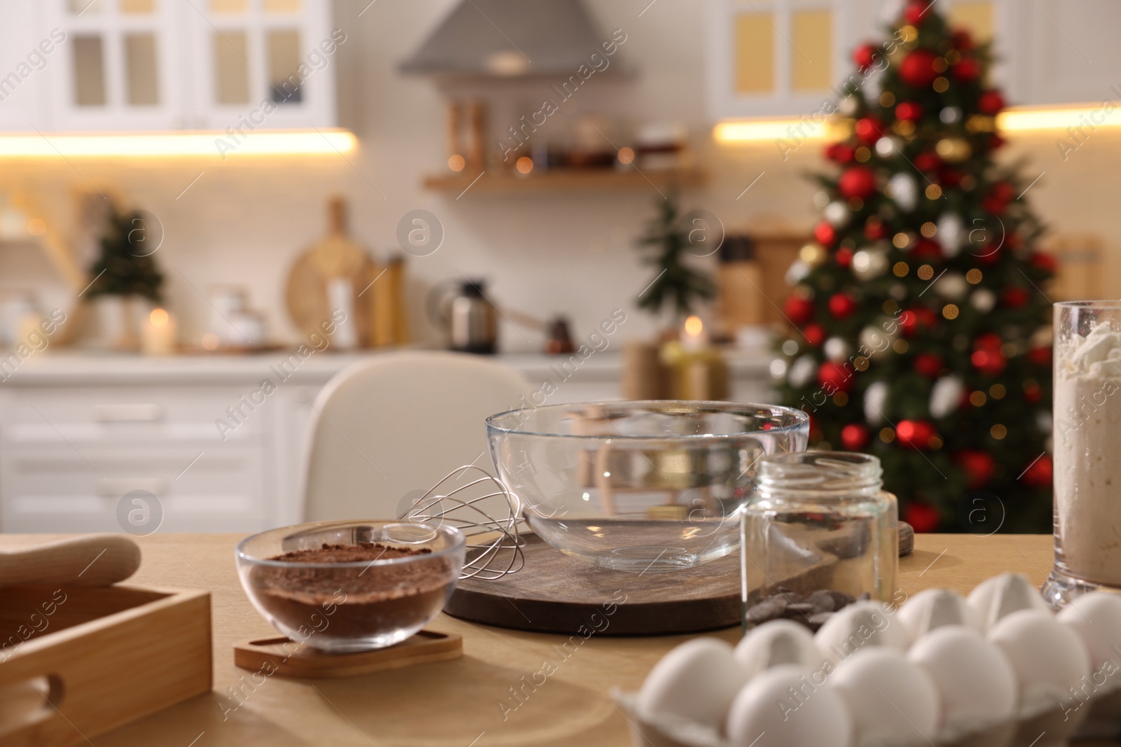 Photo of Ingredients on wooden table in kitchen. Making homemade Christmas cookies