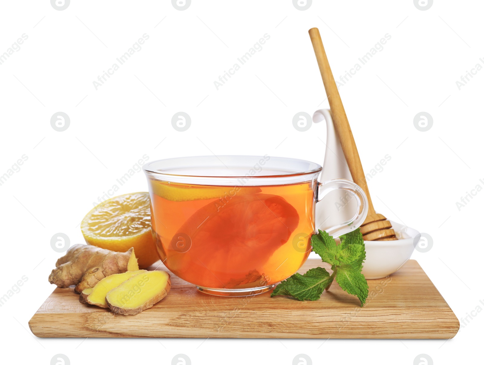 Photo of Wooden board with delicious ginger tea and ingredients on white background