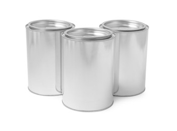 Photo of Many cans of paints on white background