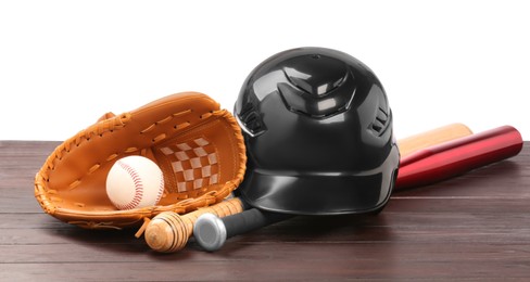 Photo of Baseball glove, bats, ball and batting helmet on wooden table against white background