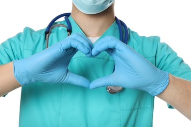 Photo of Doctor or medical assistant (male nurse) making heart with hands on white background, closeup