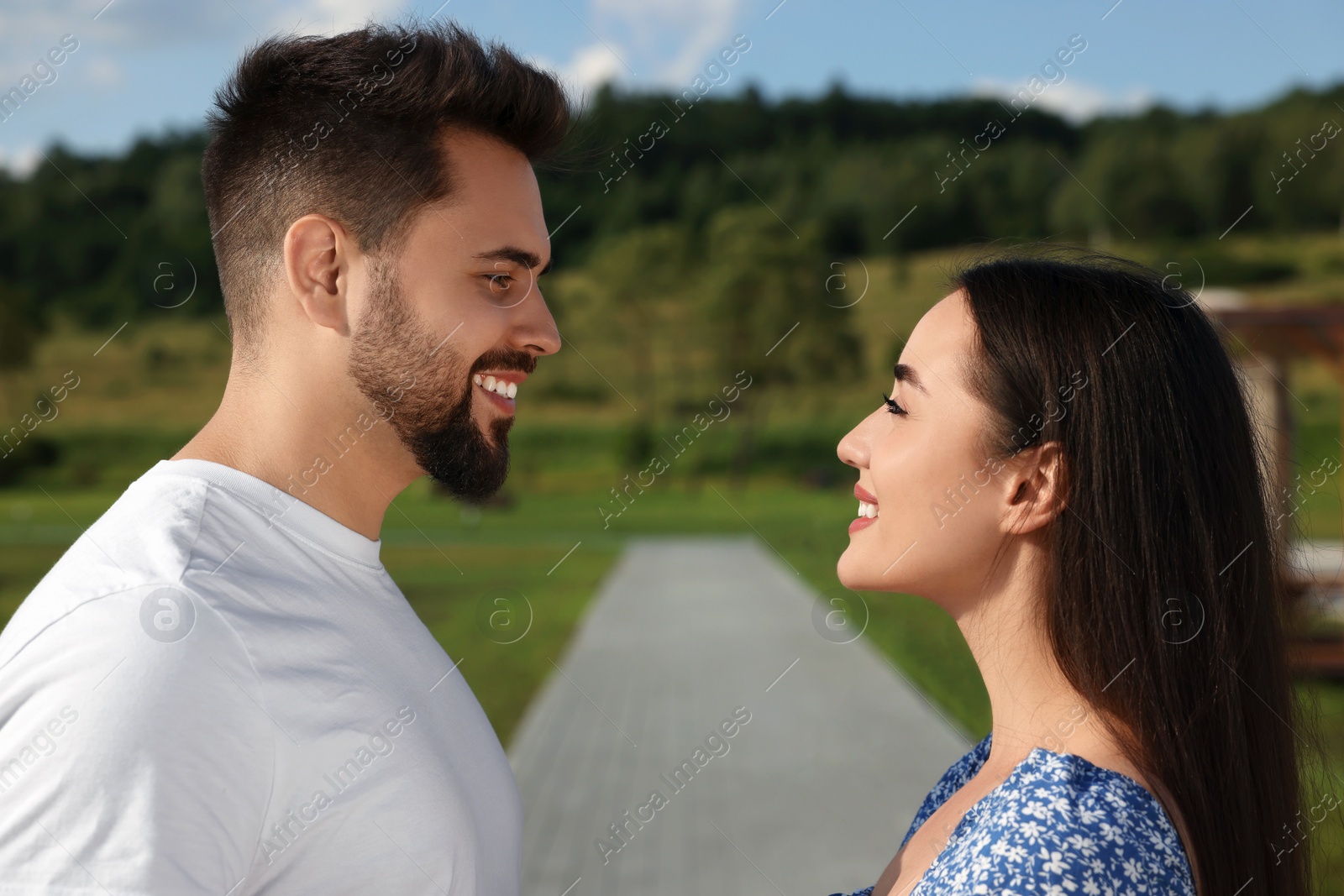 Photo of Romantic date. Beautiful couple spending time together outdoors
