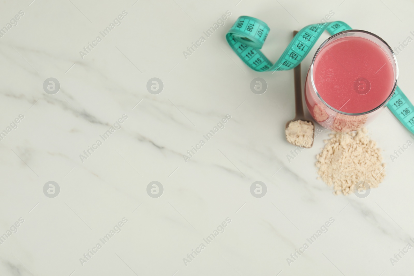 Photo of Tasty shake, measuring tape and powder on white marble table, top view with space for text. Weight loss