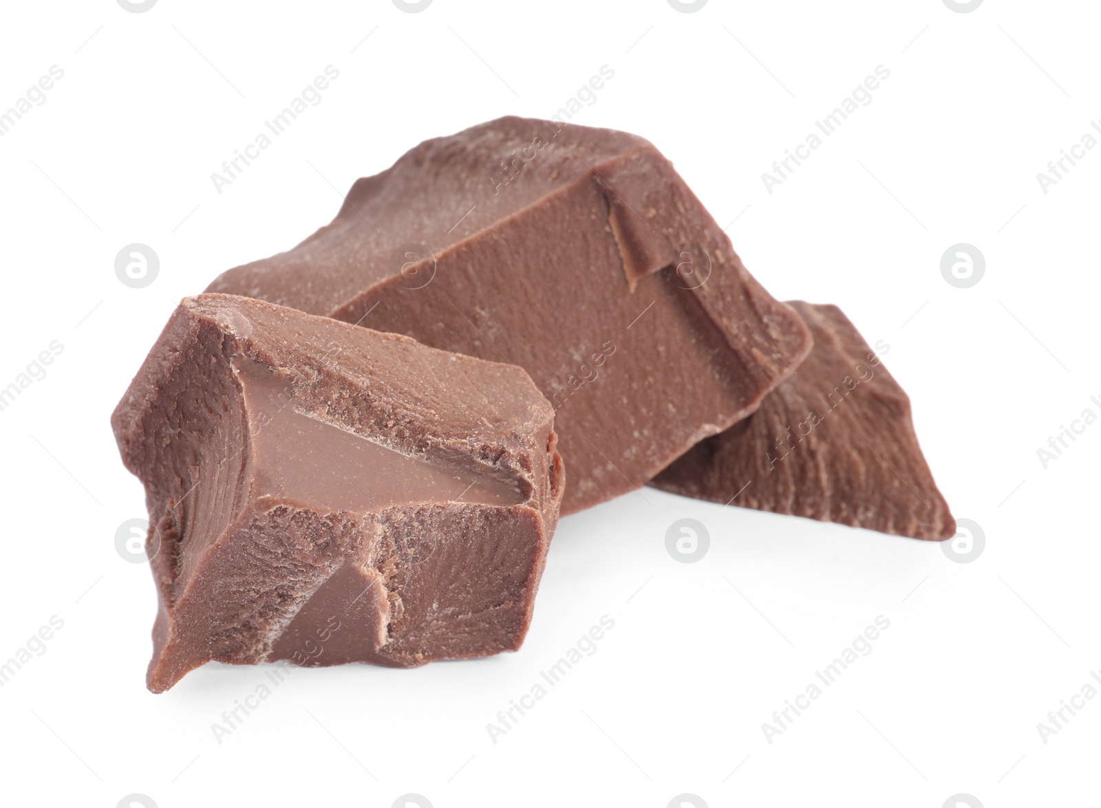 Photo of Pieces of tasty milk chocolate isolated on white