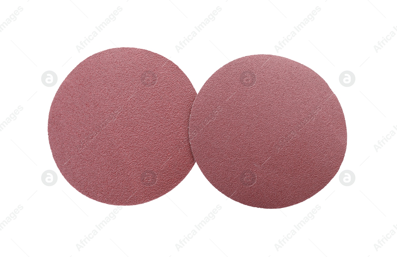 Photo of Two coarse sandpaper disks isolated on white, top view