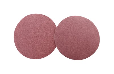 Photo of Two coarse sandpaper disks isolated on white, top view