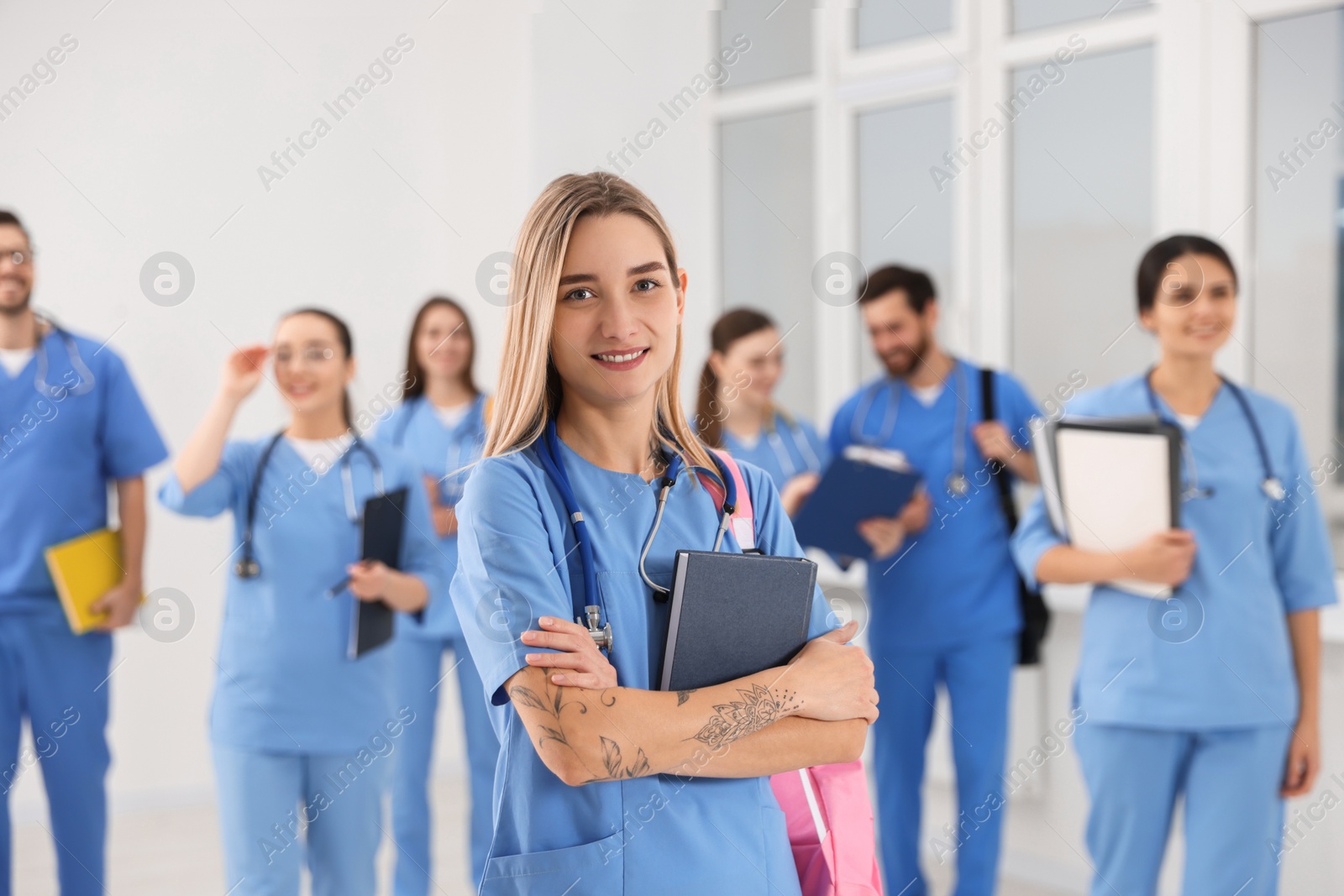 Photo of Young medical student with her classmates in university