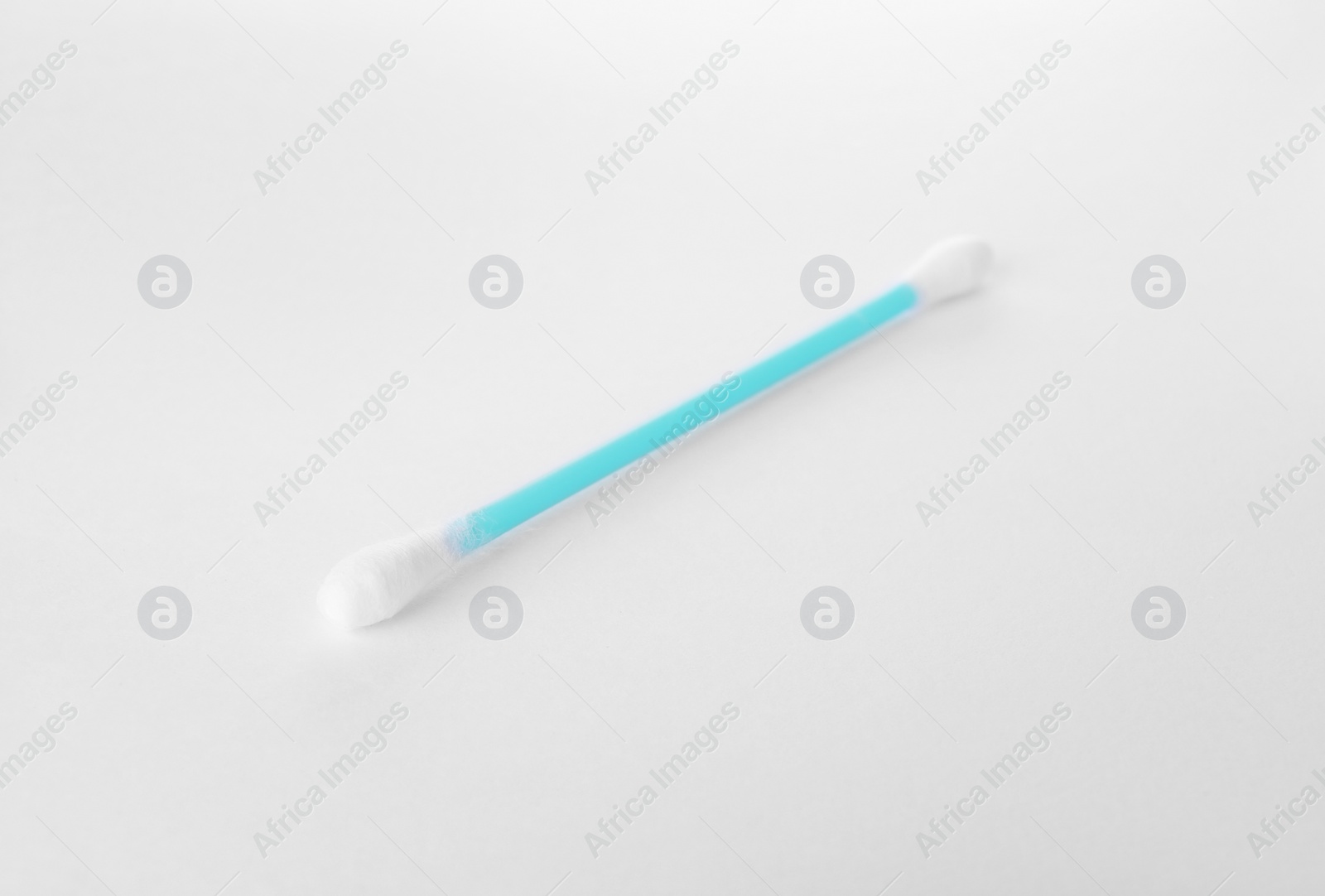 Photo of Clean cotton bud isolated on white. Hygienic accessory