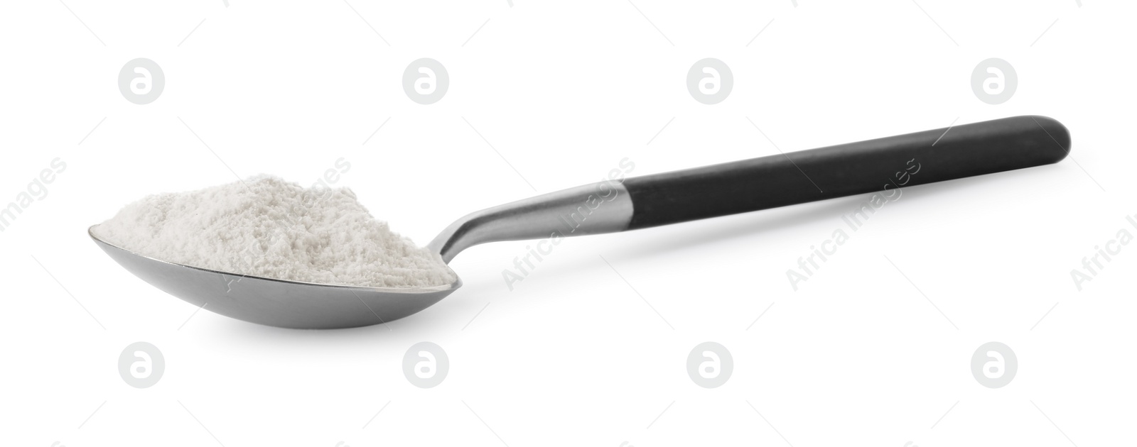 Photo of Baking powder in spoon isolated on white