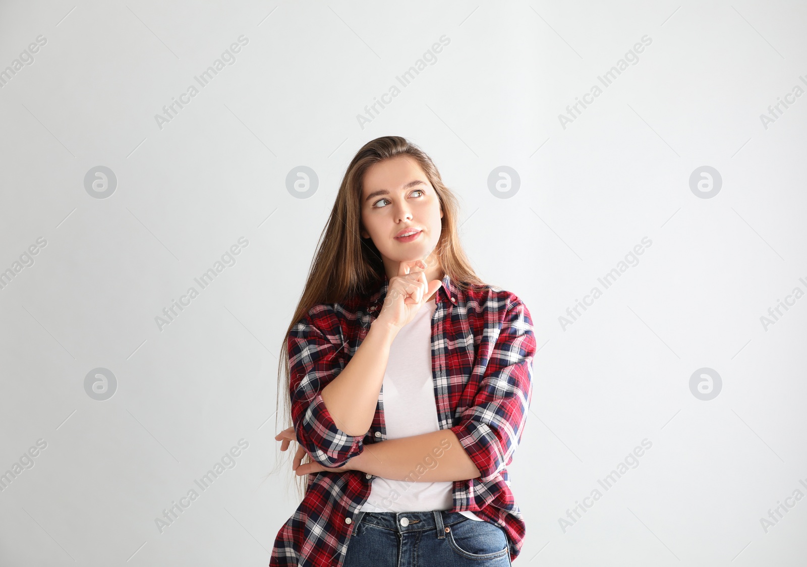 Photo of Portrait of young woman on light background